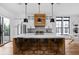 Modern kitchen with a large center island, stylish barstools, stainless steel appliances, and ample counter space at 2134 N New Jersey St, Indianapolis, IN 46202