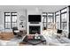 Bright living room with modern fireplace, large windows, and comfortable seating arrangement at 2134 N New Jersey St, Indianapolis, IN 46202
