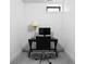 Office space featuring minimalist design with black desk, chair, and monitor against bright white wall at 2134 N New Jersey St, Indianapolis, IN 46202