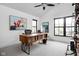 Contemporary home office with a desk featuring built-in shelving and large windows for natural light at 2134 N New Jersey St, Indianapolis, IN 46202