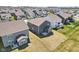 Neighborhood aerial showing a variety of houses, green lawns, and organized street layouts on a sunny day at 2250 Egbert Rd, Westfield, IN 46074