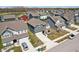 Picturesque aerial view of a neighborhood showcasing neat homes, manicured lawns, and a peaceful pond at 2250 Egbert Rd, Westfield, IN 46074
