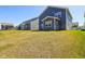 Expansive backyard showing a row of well-maintained homes with neat siding and green lawns on a sunny day at 2250 Egbert Rd, Westfield, IN 46074