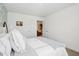 Bright bedroom with a queen-sized bed, decorated with an artful blue throw, and two doors providing a sense of spaciousness at 2250 Egbert Rd, Westfield, IN 46074