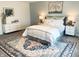 Comfortable bedroom with plush carpet, white linens, and stylish blue patterned rug at 2250 Egbert Rd, Westfield, IN 46074