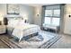 Bright bedroom features soft carpet, white bedding, and a blue patterned rug at 2250 Egbert Rd, Westfield, IN 46074