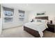 Cozy bedroom with a neatly made bed, soft carpet, and two bright windows dressed with charming, patterned blinds at 2250 Egbert Rd, Westfield, IN 46074