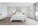 Comfortable bedroom features two side tables, lamps, and an eye-catching piece of art at 2250 Egbert Rd, Westfield, IN 46074
