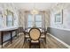 Elegant dining room featuring a chandelier, gray wallpaper, and a dining table with seating for six at 2250 Egbert Rd, Westfield, IN 46074