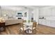 A modern dining area adjacent to a kitchen and living room, with stylish decor and finishes at 2250 Egbert Rd, Westfield, IN 46074