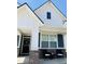 Charming two-story home featuring a welcoming porch with stylish brickwork and an inviting front door with a wreath at 2250 Egbert Rd, Westfield, IN 46074