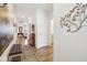 Bright hallway featuring hardwood floors, stylish decor, and access to various rooms at 2250 Egbert Rd, Westfield, IN 46074