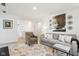 Cozy living room featuring a comfortable sofa, stylish decor, patterned rug and view into the hallway at 2250 Egbert Rd, Westfield, IN 46074