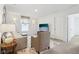 Bright living room offers plush seating, a patterned rug, and a mounted TV, creating a cozy and inviting atmosphere at 2250 Egbert Rd, Westfield, IN 46074