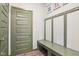 A well-organized mudroom features a built-in bench with hooks, storage, and a durable door, ideal for entry and organization at 2250 Egbert Rd, Westfield, IN 46074