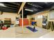 Finished basement area with black painted ceiling, concrete walls and a storage area at 2263 N Delaware St, Indianapolis, IN 46205