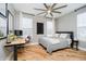 Bedroom with a home office set up, hardwood floors, and natural light at 2263 N Delaware St, Indianapolis, IN 46205