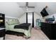 Attic bedroom features modern ceiling fan, TV, and lots of storage at 2263 N Delaware St, Indianapolis, IN 46205