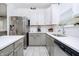 Modern kitchen with white cabinets, stainless steel appliances and white countertops at 2263 N Delaware St, Indianapolis, IN 46205