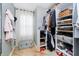 Spacious walk-in closet with ample shelving, hanging space, and a storage chest at 2263 N Delaware St, Indianapolis, IN 46205