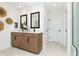 Bright bathroom featuring double sinks, contemporary mirrors, and stylish wood cabinets at 261 Onset Way, Westfield, IN 46074