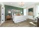 Stylish bedroom featuring a decorative accent wall, modern lighting, and large windows at 261 Onset Way, Westfield, IN 46074