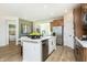 Kitchen featuring stainless steel appliances and island with seating that faces a bedroom at 261 Onset Way, Westfield, IN 46074