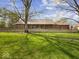 Spacious backyard featuring a covered patio and screened-in porch, perfect for outdoor enjoyment at 2810 Winterway Dr, Shelbyville, IN 46176