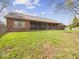 Expansive backyard featuring a screened-in porch and covered patio, ideal for outdoor relaxation and entertaining at 2810 Winterway Dr, Shelbyville, IN 46176