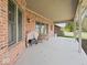 Back patio featuring a grill, outdoor seating, and brick walls, ideal for outdoor entertaining at 2810 Winterway Dr, Shelbyville, IN 46176