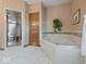 Bathroom showcasing a corner tub, and a separate walk-in shower at 2810 Winterway Dr, Shelbyville, IN 46176