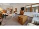 Primary bedroom with ceiling fan, carpet, sitting area, and access to a private bath at 2810 Winterway Dr, Shelbyville, IN 46176