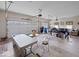 Spacious garage featuring ample storage, a large work area, and multiple seating areas for relaxation or productivity at 2810 Winterway Dr, Shelbyville, IN 46176