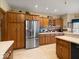 Large kitchen with oak cabinets, stainless steel fridge, and lots of counter space at 2810 Winterway Dr, Shelbyville, IN 46176