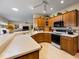Bright kitchen featuring oak cabinets, a breakfast bar, and modern appliances at 2810 Winterway Dr, Shelbyville, IN 46176