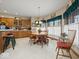Eat in kitchen with wooden table and chairs and light-filled windows at 2810 Winterway Dr, Shelbyville, IN 46176