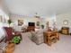 Spacious living room featuring carpeted floors, ceiling fan, and natural light at 2810 Winterway Dr, Shelbyville, IN 46176