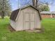 Backyard shed with double doors, perfect for storage and lawn equipment at 2810 Winterway Dr, Shelbyville, IN 46176