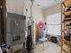 This utility room includes a furnace, water heater, and storage shelves for household supplies at 2810 Winterway Dr, Shelbyville, IN 46176