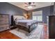 Comfortable bedroom with wood floors, furniture, and a window at 2890 Trillium Way, Columbus, IN 47201