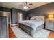 Spacious bedroom with a ceiling fan, wood floors, and furniture at 2890 Trillium Way, Columbus, IN 47201