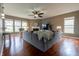 Open living room featuring a gray sofa, and a bright fireplace at 2890 Trillium Way, Columbus, IN 47201