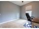 Office featuring a large window, carpet flooring, and an office chair and desk at 2890 Trillium Way, Columbus, IN 47201