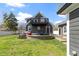 The home's backyard has an outdoor fire pit, grill, seating and a covered deck at 3015 S Rybolt Ave, Indianapolis, IN 46241