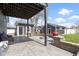 This backyard features a patio, fire pit, shed, and grassy area at 3015 S Rybolt Ave, Indianapolis, IN 46241