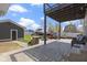 Spacious backyard with a patio, fire pit, shed, and ample seating at 3015 S Rybolt Ave, Indianapolis, IN 46241