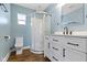 Bathroom featuring a glass-enclosed shower, a toilet, and a white vanity at 3015 S Rybolt Ave, Indianapolis, IN 46241