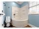 Bathroom includes a tub and shower combo with a neutral-colored toilet at 3015 S Rybolt Ave, Indianapolis, IN 46241