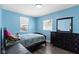 A cozy bedroom features a bed, a window, and a black dresser at 3015 S Rybolt Ave, Indianapolis, IN 46241