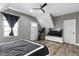 Bedroom with a dark accent wall, hardwood floors and a ceiling fan at 3015 S Rybolt Ave, Indianapolis, IN 46241